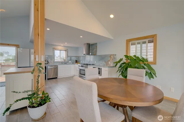 a kitchen with a table and chairs