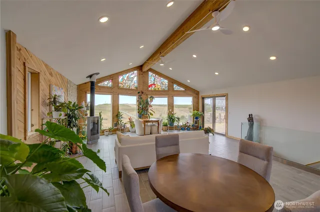 a lobby with furniture and floor to ceiling window