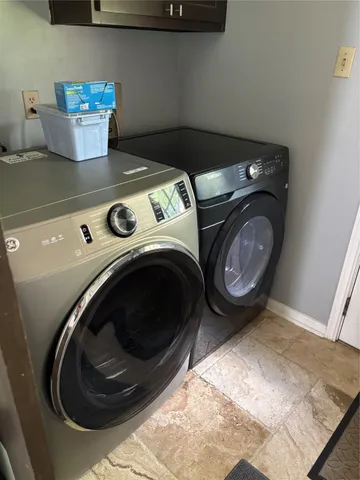a utility room with dryer and washer