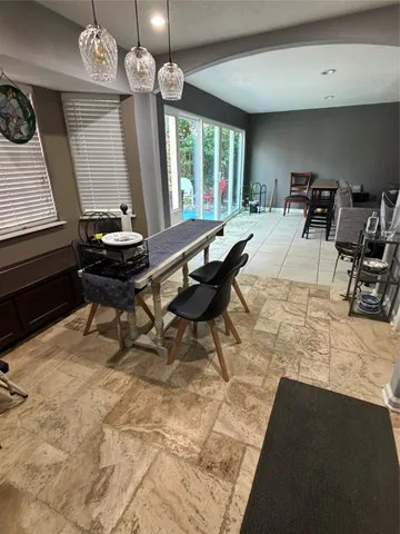 a living room with a table or chairs and a wooden floor