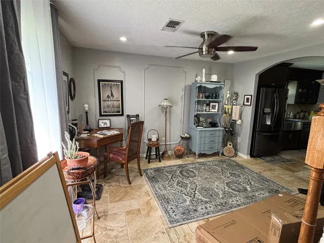 a living room with furniture and a rug