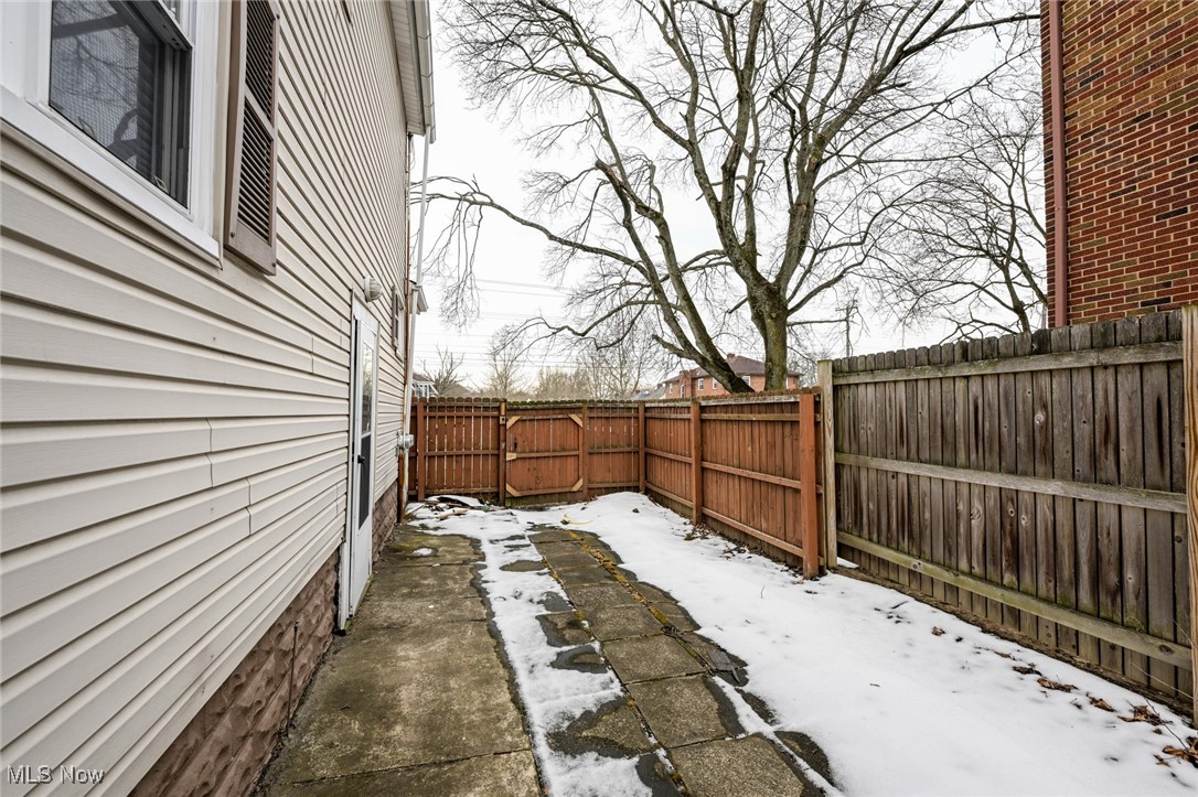 1164 Copley Road Akron, OH 44320 - Photo 49 of 50 Yard covered in snow featuring a fenced backyard