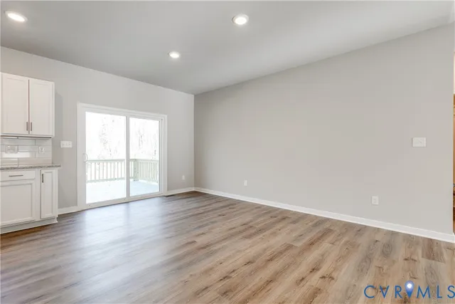 a kitchen with stainless steel appliances granite countertop a sink a stove and a microwave