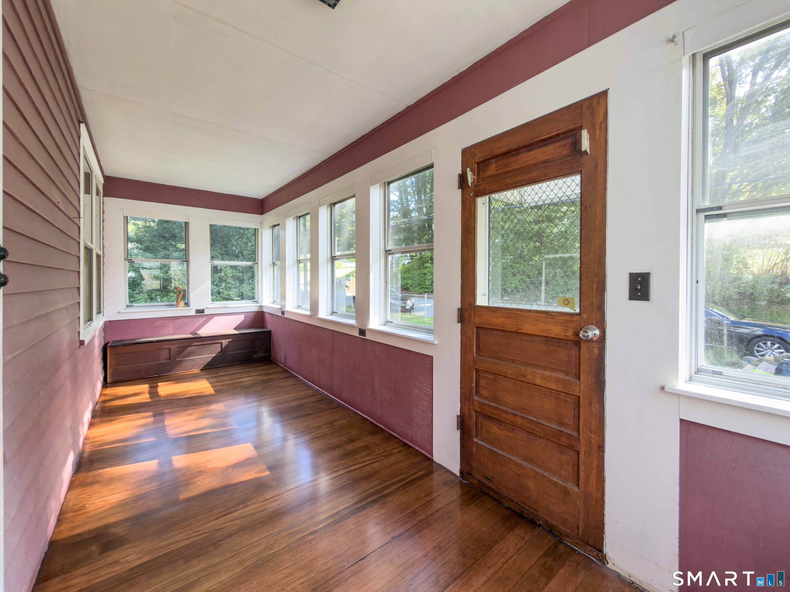 72 Roosevelt Avenue Norwich, CT 06360 - Photo 17 of 24 Enclosed front porch with dryer hookup.