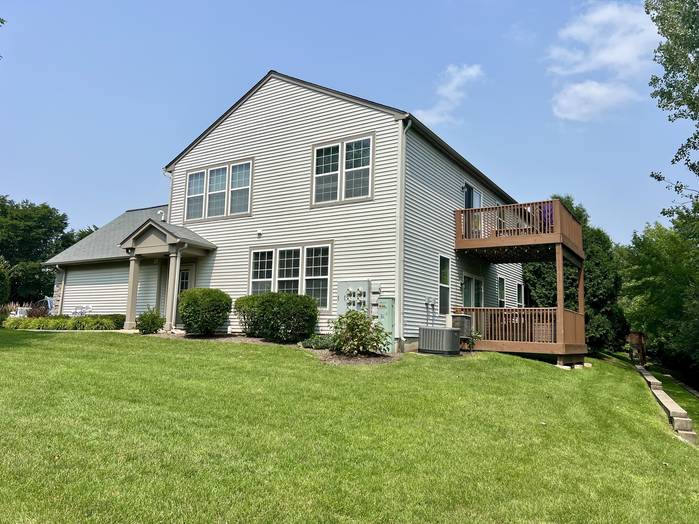 473 Metropolitan Street, Unit 473 Aurora, IL 60502 - Photo 1 of 8 a front view of a house with a yard and porch