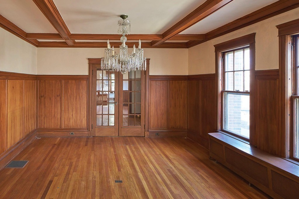 236 Buckminster Road Brookline, MA 02445 - Photo 3 of 8 a view of empty room with wooden floor and fan