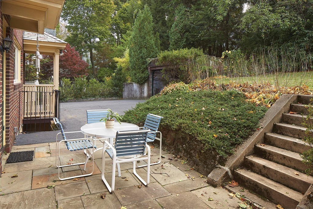 236 Buckminster Road Brookline, MA 02445 - Photo 7 of 8 a view of a chairs and tables in the back yard of the house