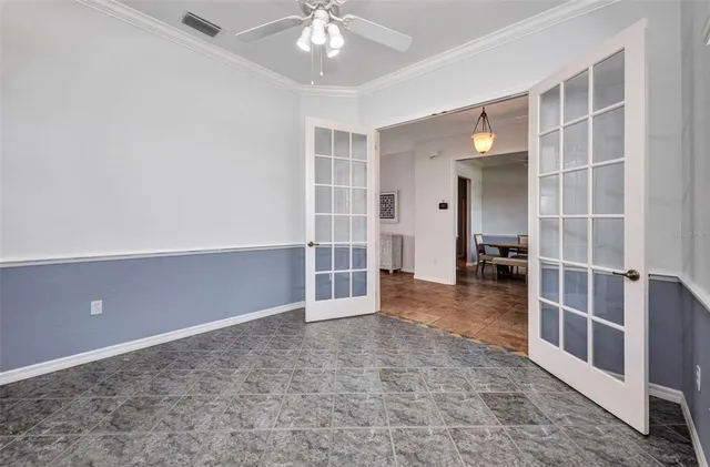 a spacious bedroom with a bed and a table in it