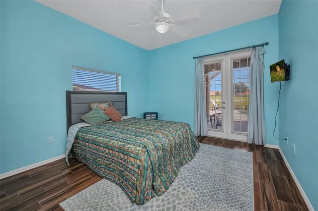 a bathroom with a granite countertop toilet a sink and shower