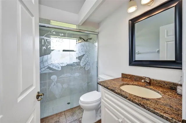 a dining room with furniture a rug and a large window