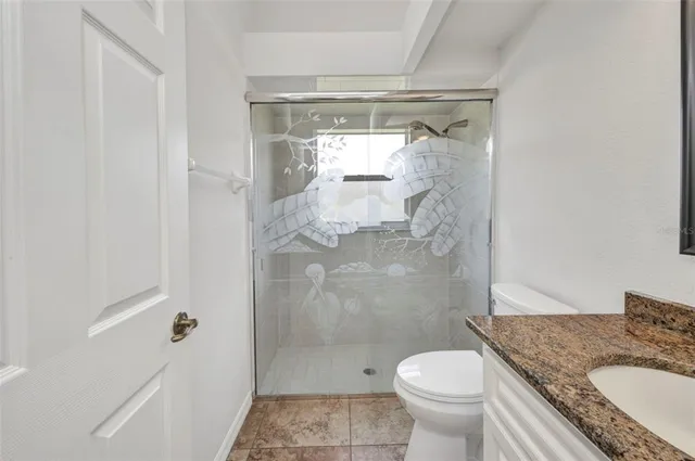 a dining room with furniture and a floor to ceiling window