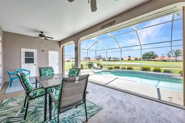 a view of a swimming pool with a patio