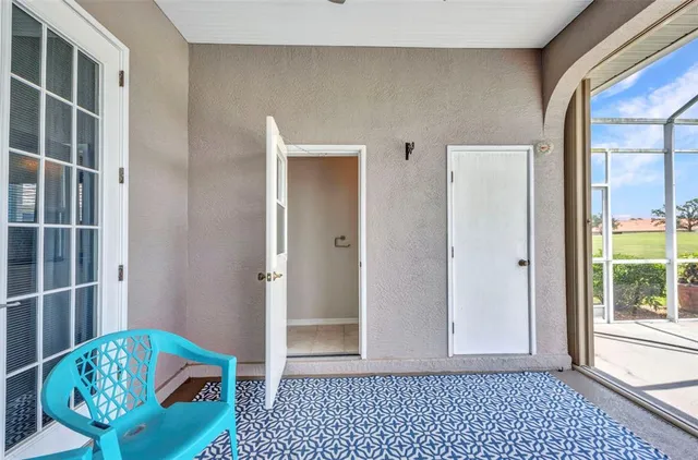 a view of a patio with swimming pool table and chairs