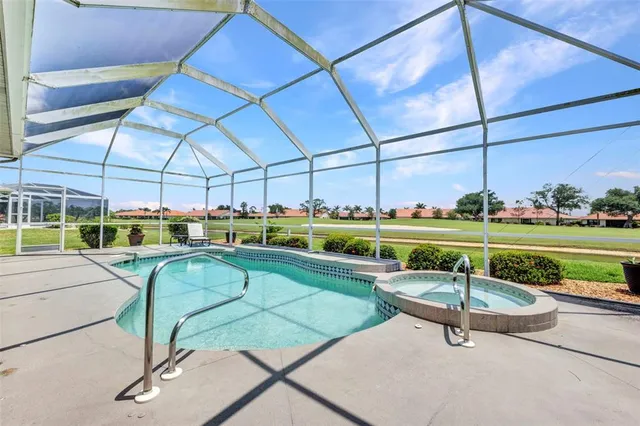 a view of a swimming pool and an outdoor seating