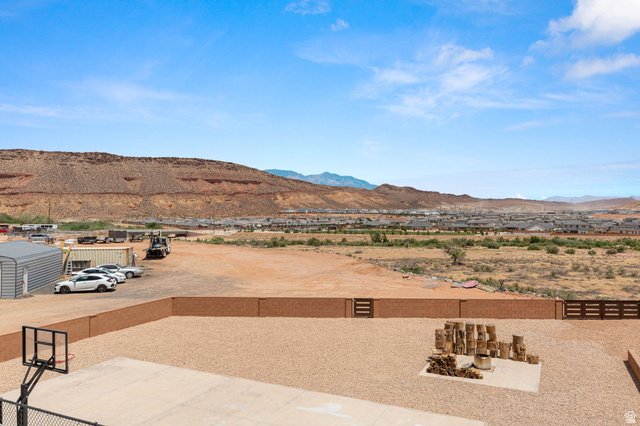 2591 East Washington Dam Road Washington, UT 84780 - Photo 52 of 67 Expansive gravel yard with a concrete sport court and a built-in fire pit area