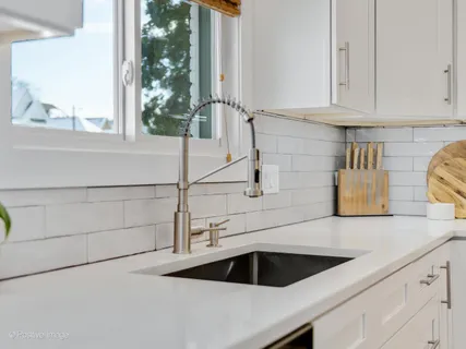 a kitchen with a sink and cabinets