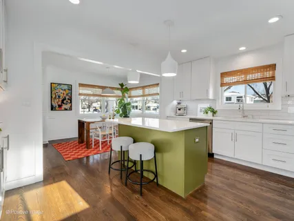 a kitchen with a table and chairs in it