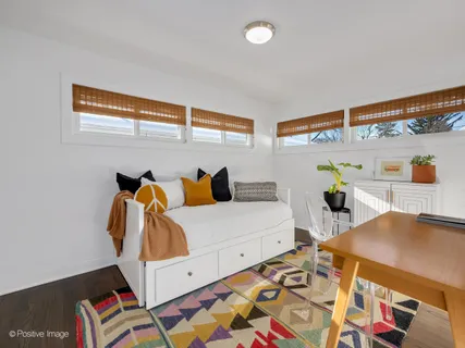 a bedroom with furniture and a bed