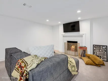 a bedroom with a bed and a television