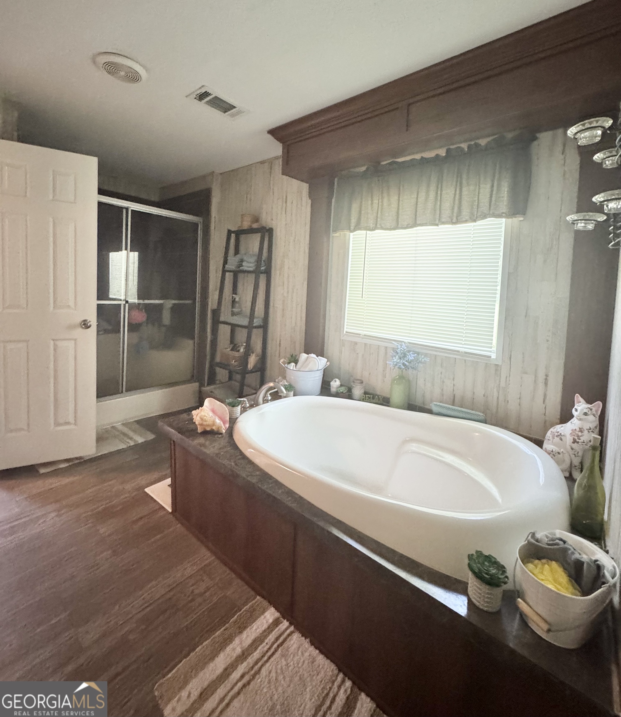 92 Graham Lane Claxton, GA 30417 - Photo 13 of 18 a bathroom with a tub sink and mirror