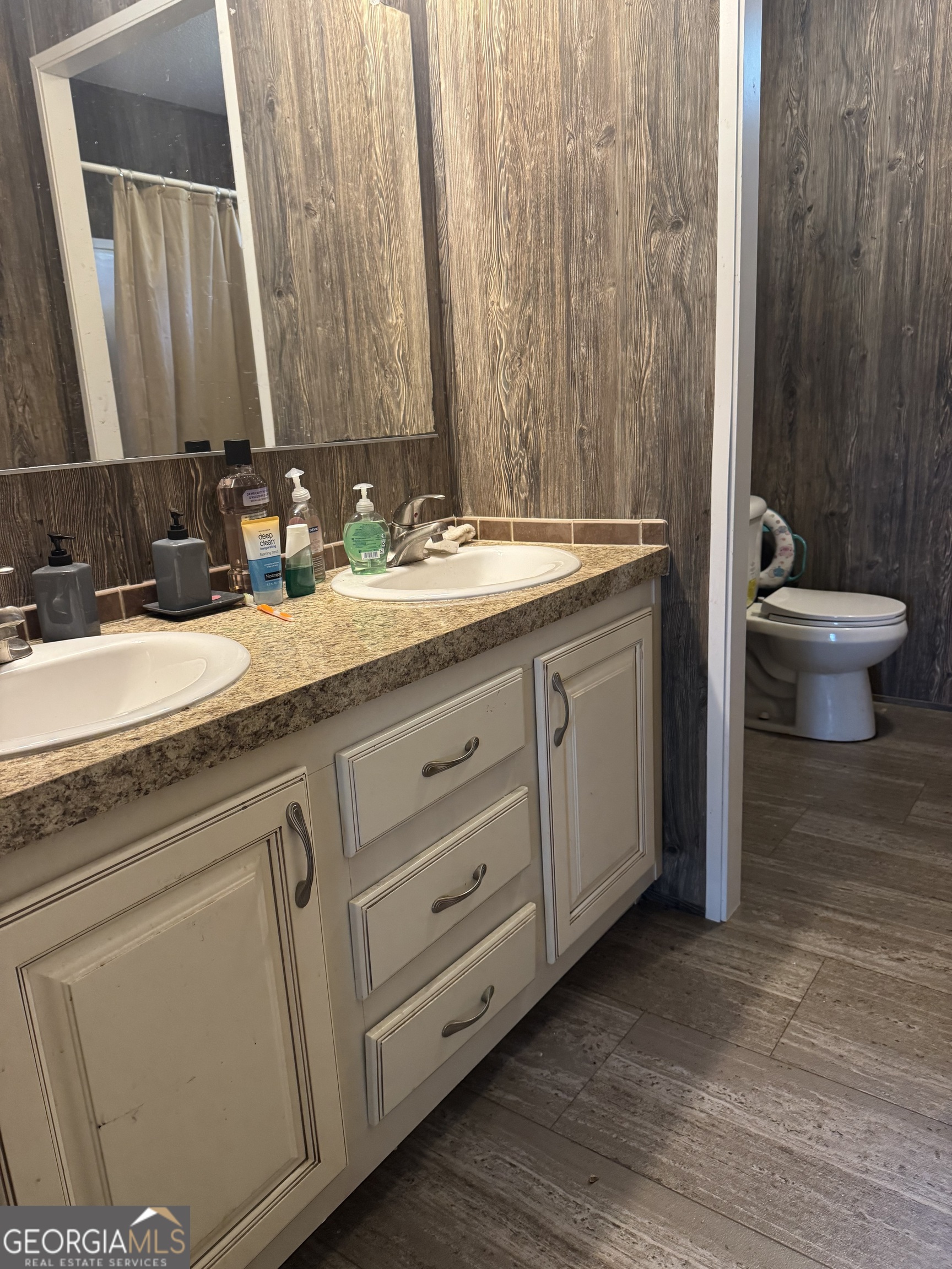 92 Graham Lane Claxton, GA 30417 - Photo 15 of 18 a bathroom with a granite countertop sink and a mirror