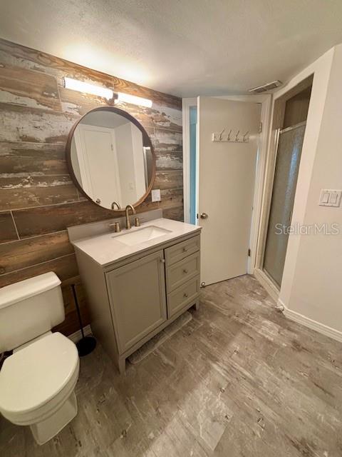 620 West Osceola Street, Unit 106 Clermont, FL 34711 - Photo 13 of 17 a bathroom with a toilet mirror and vanity