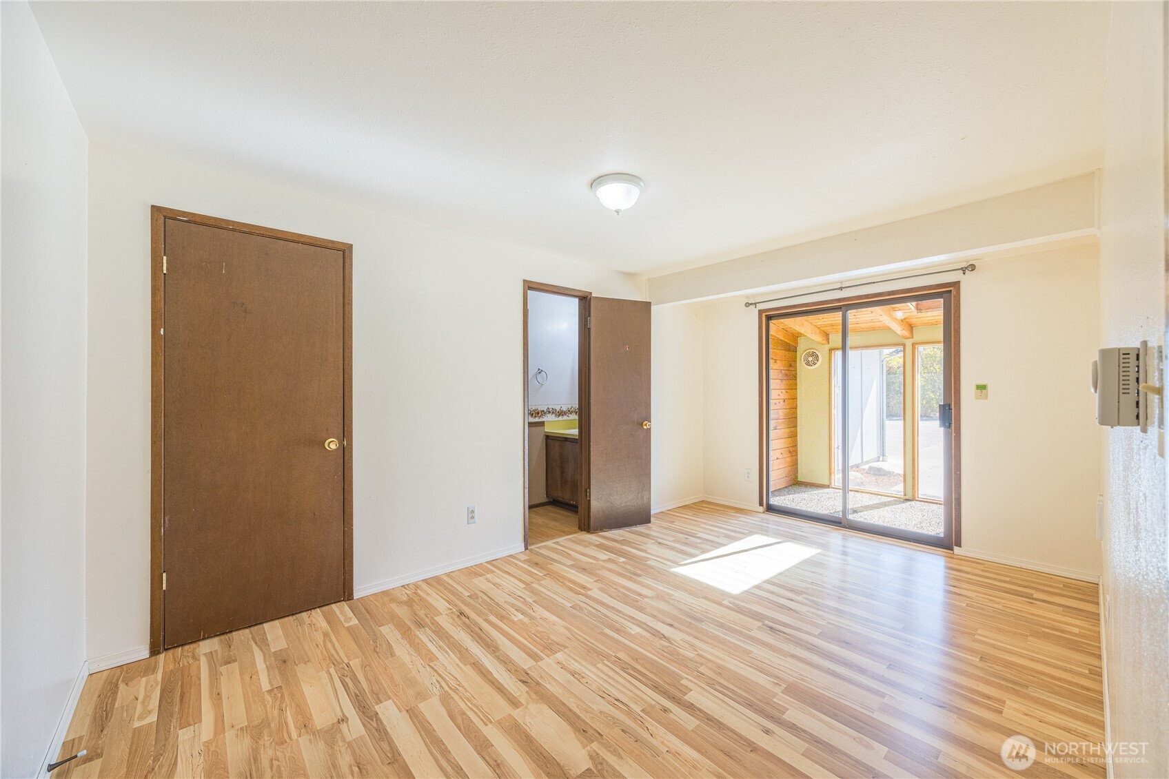 323 West Fir Street Sequim, WA 98382 - Photo 20 of 40 a bedroom with a bed and a window