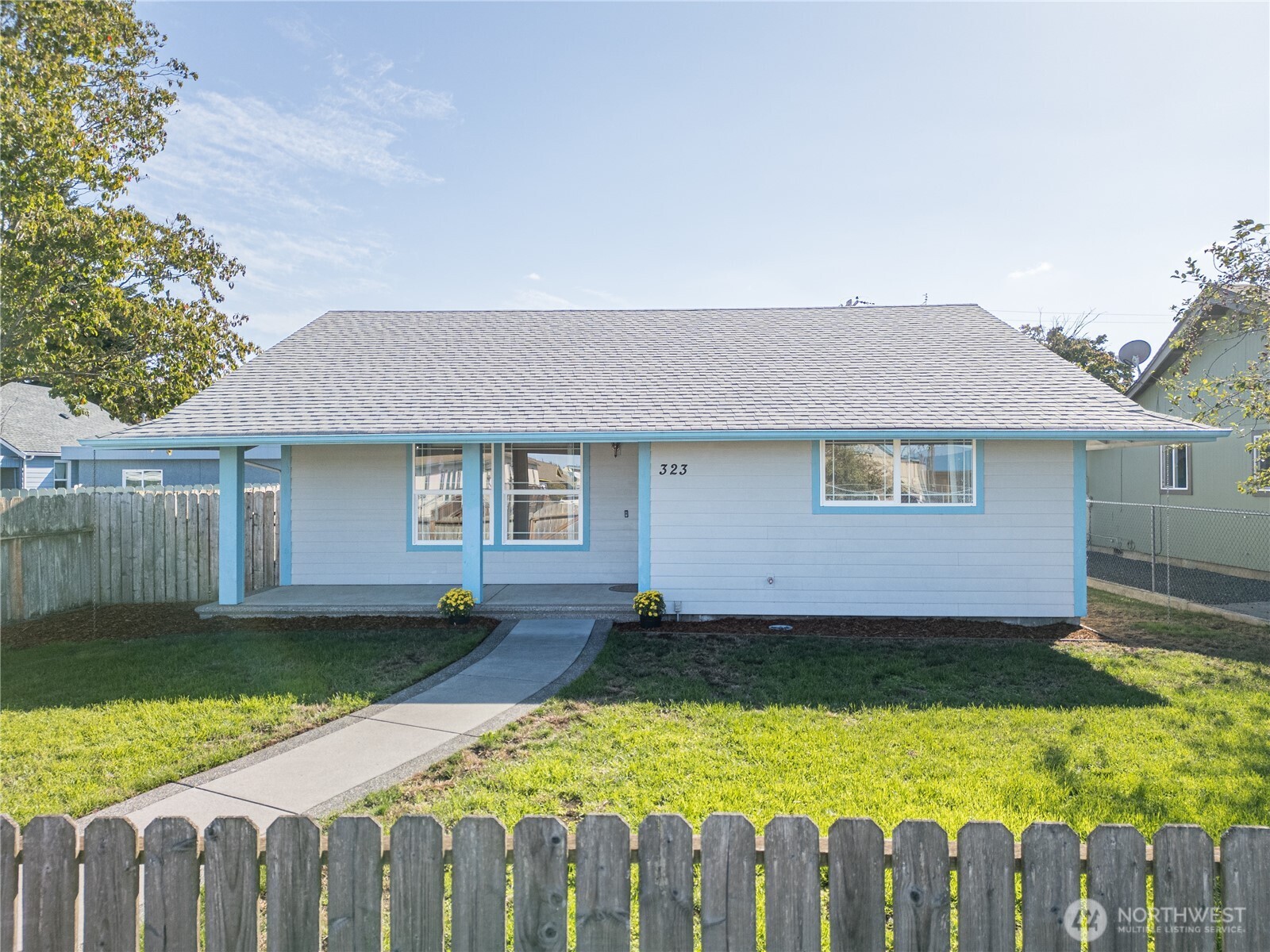 323 West Fir Street Sequim, WA 98382 - Photo 2 of 40 a view of a house with wooden floor and a yard