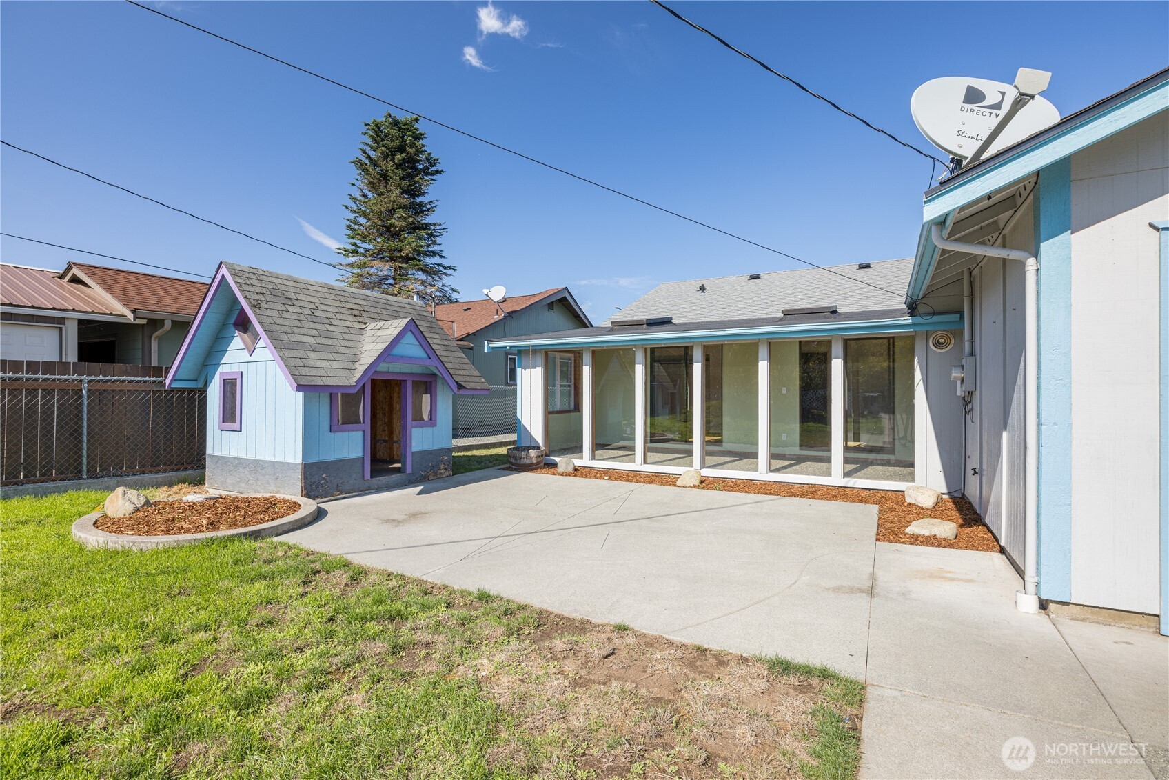 323 West Fir Street Sequim, WA 98382 - Photo 27 of 40 a front view of a house with a garden