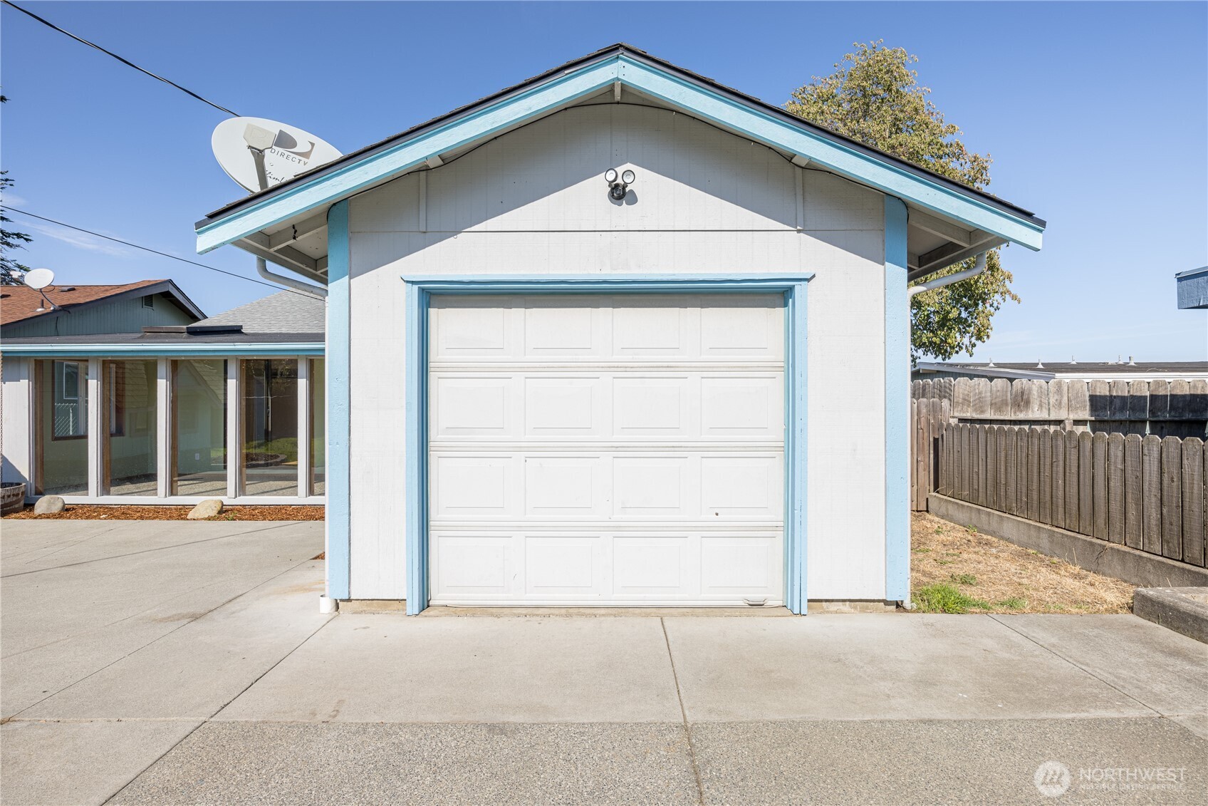 323 West Fir Street Sequim, WA 98382 - Photo 28 of 40 a front view of a house with a garage