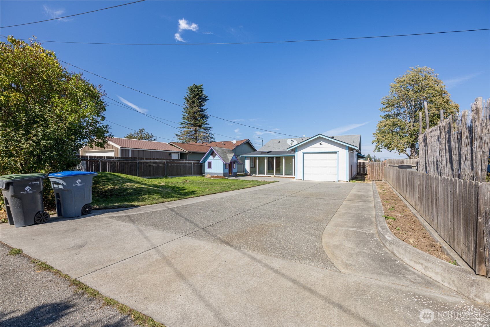 323 West Fir Street Sequim, WA 98382 - Photo 36 of 40 a front view of a house with a yard