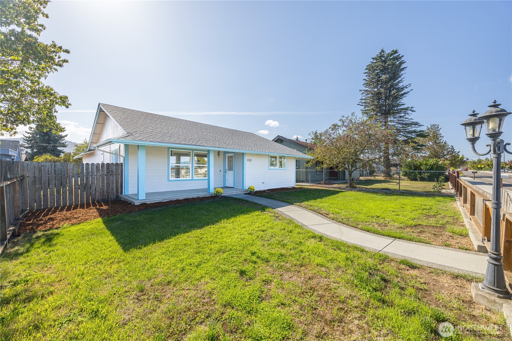 323 West Fir Street Sequim, WA 98382 - Photo 40 of 40 a view of a house with backyard and a tree