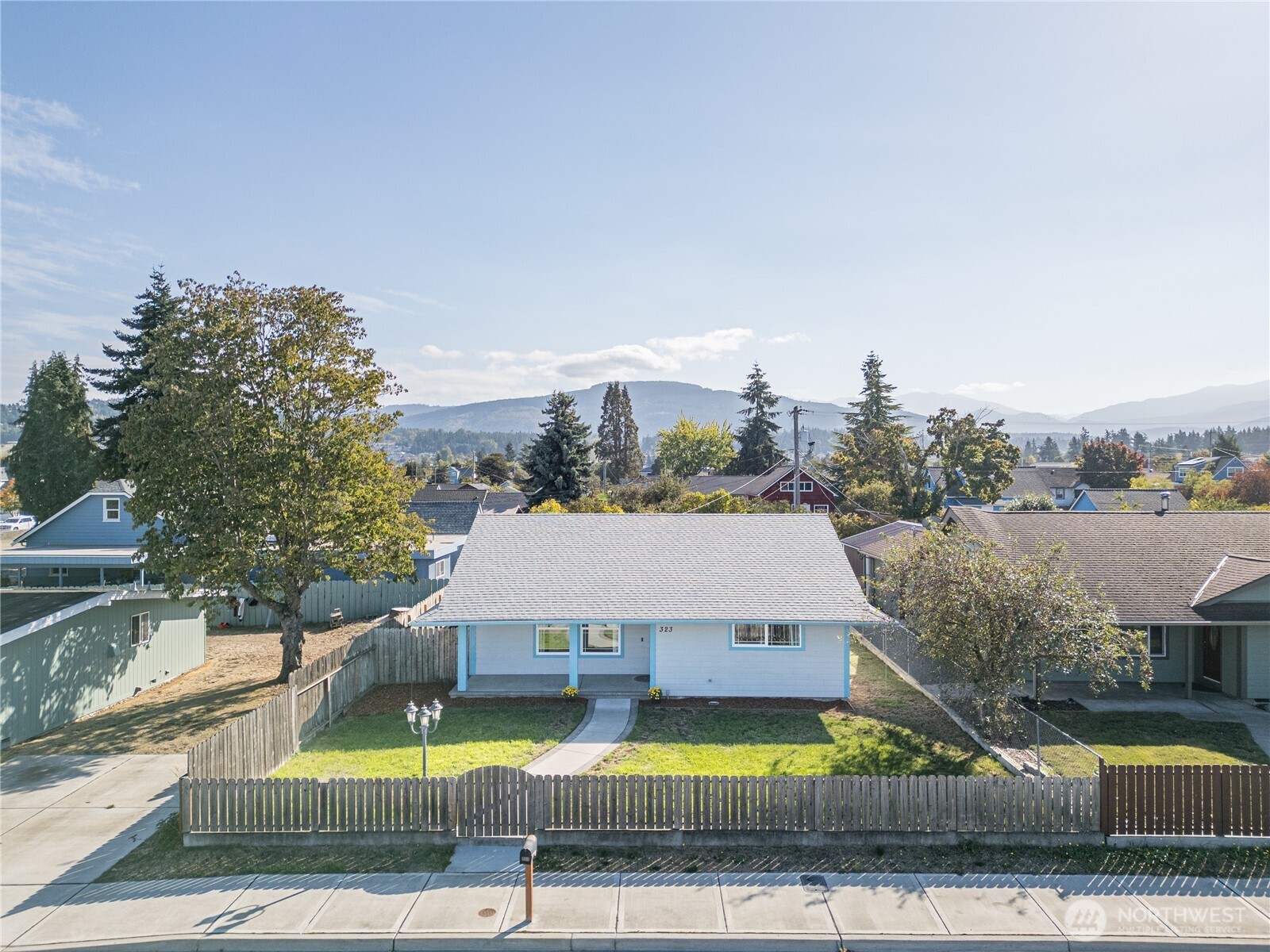 323 West Fir Street Sequim, WA 98382 - Photo 5 of 40 a view of a house with swimming pool and sitting area