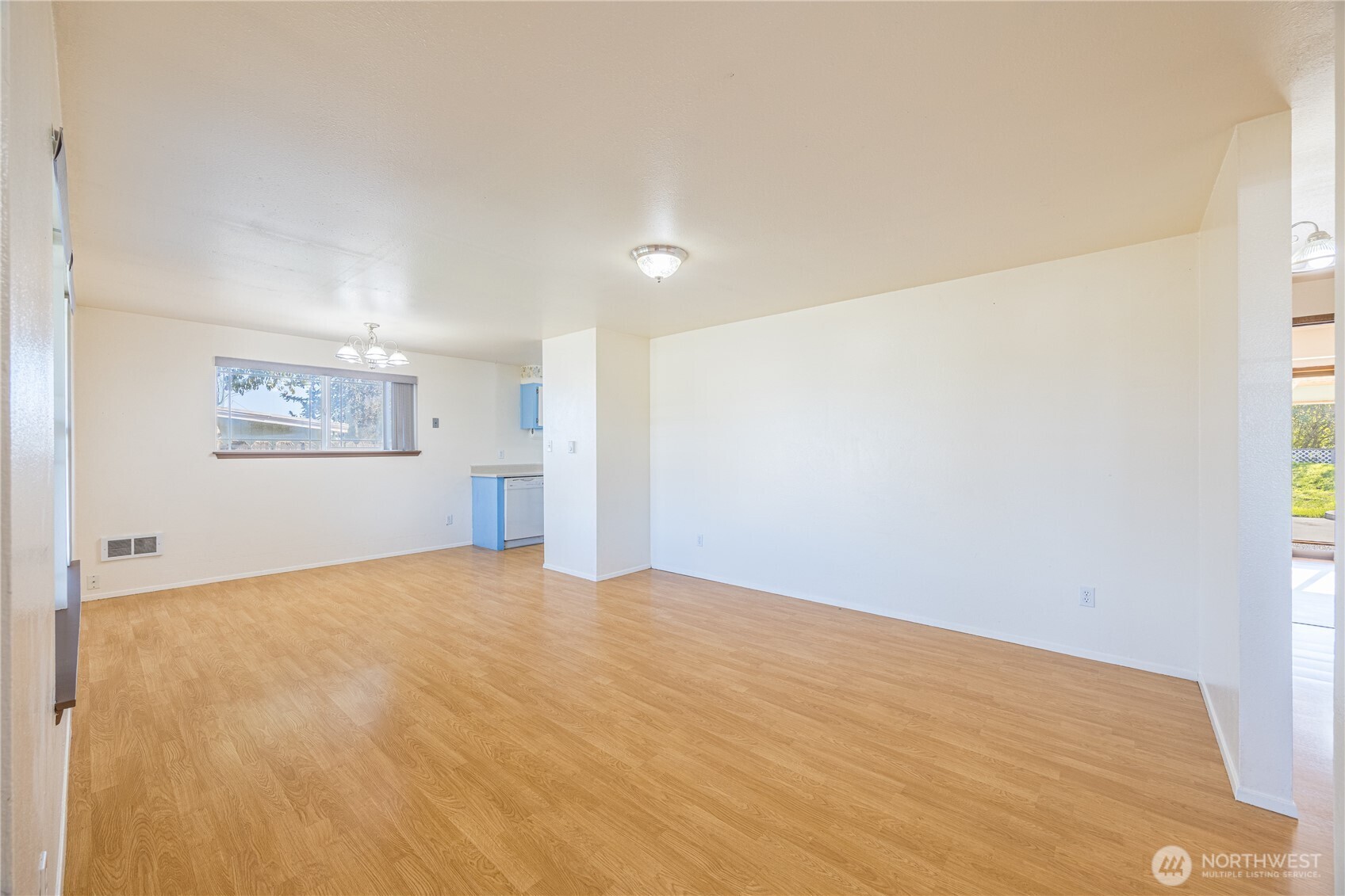 323 West Fir Street Sequim, WA 98382 - Photo 9 of 40 a view of an empty room with a window