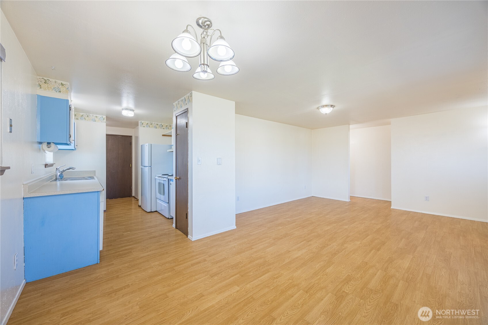 323 West Fir Street Sequim, WA 98382 - Photo 10 of 40 a view of a kitchen with a sink and cabinet area