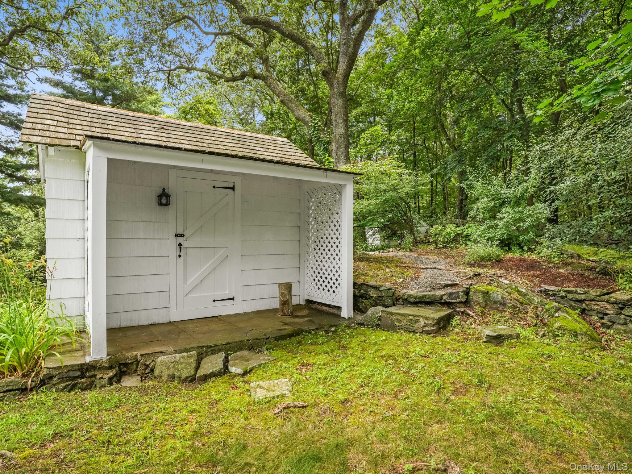 8 South Bedford Road Pound Ridge, NY 10576 - Photo 5 of 32 a view of backyard with cabin