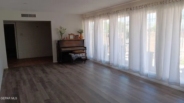 a living room with furniture and a window
