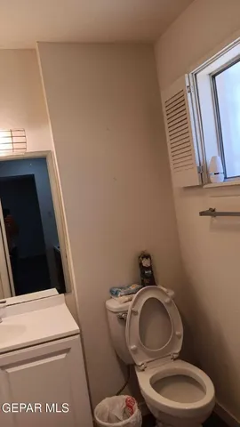 a bathroom with a toilet and a sink