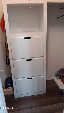 a view of an empty walk in closet