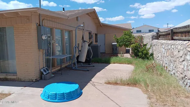 a view of a porch with furniture and a fire pit