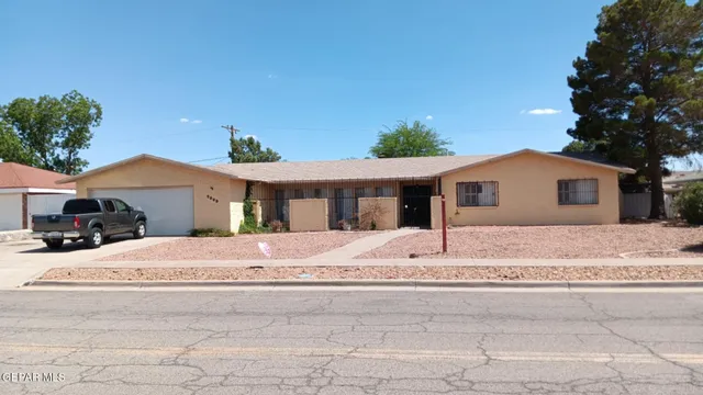a house with yard in front of it