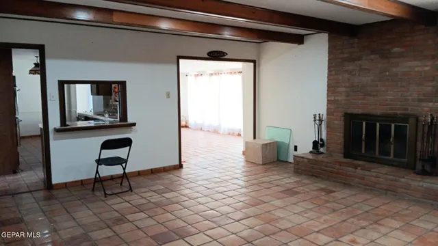 a view of a livingroom with furniture and a fireplace