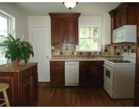 383 Marrett Road Lexington, MA 02421 - Photo 12 of 18 a kitchen with a sink stove and cabinets