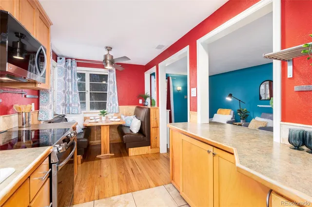 a view of a living room and kitchen