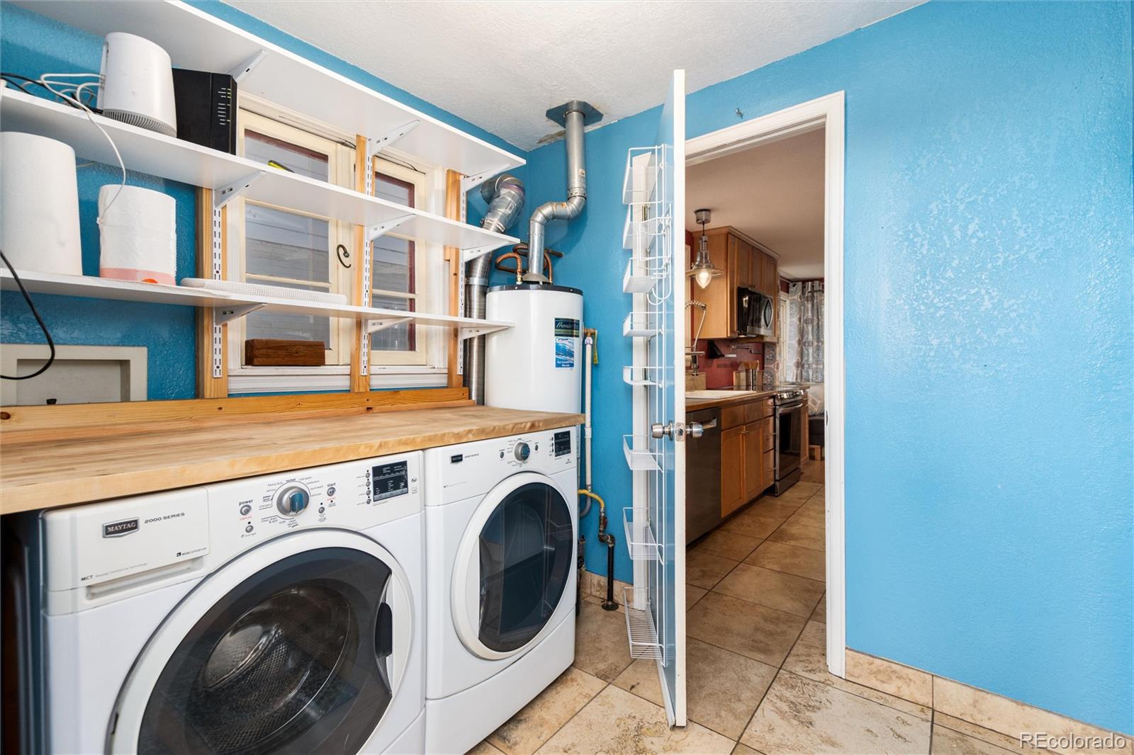 3100 Ames Street Wheat Ridge, CO 80214 - Photo 21 of 39 a view of living room with washer and dryer