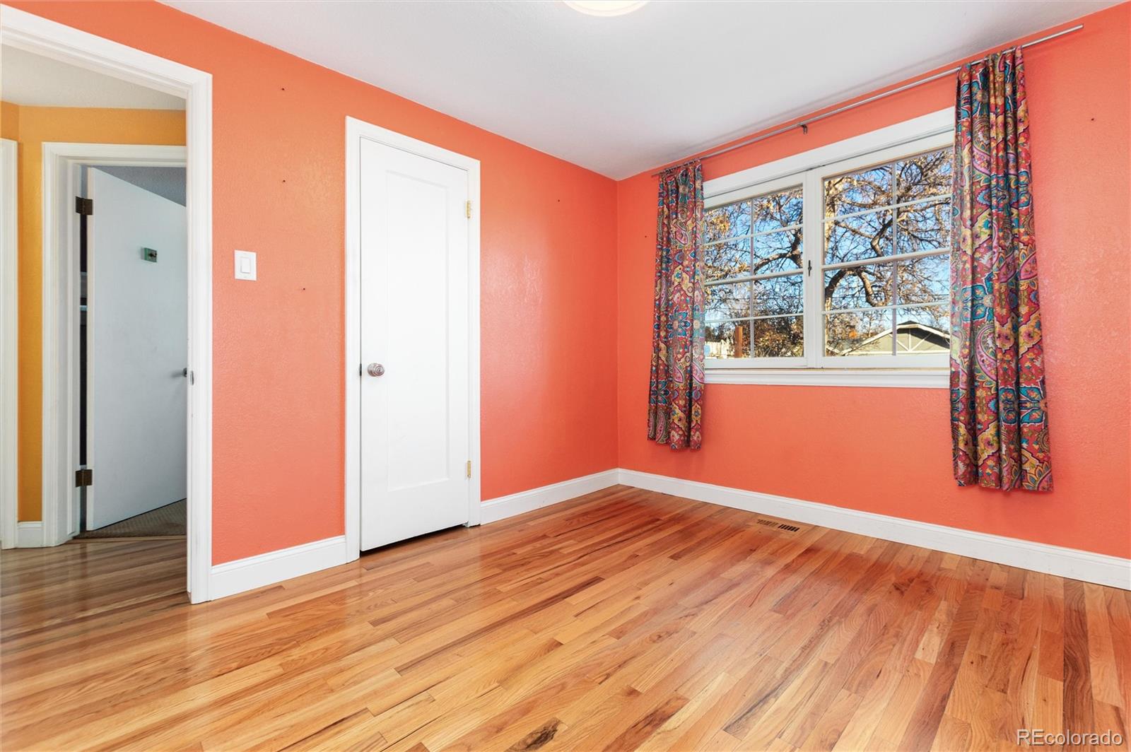 3100 Ames Street Wheat Ridge, CO 80214 - Photo 27 of 39 an empty room with wooden floor and a window