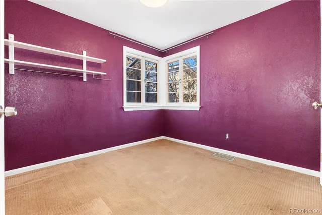 a view of a room with a large window