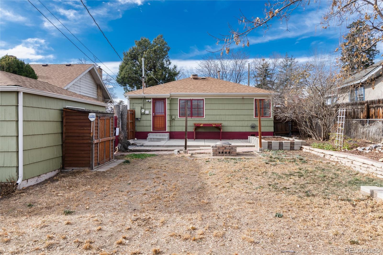 3100 Ames Street Wheat Ridge, CO 80214 - Photo 31 of 39 a view of a house with a yard