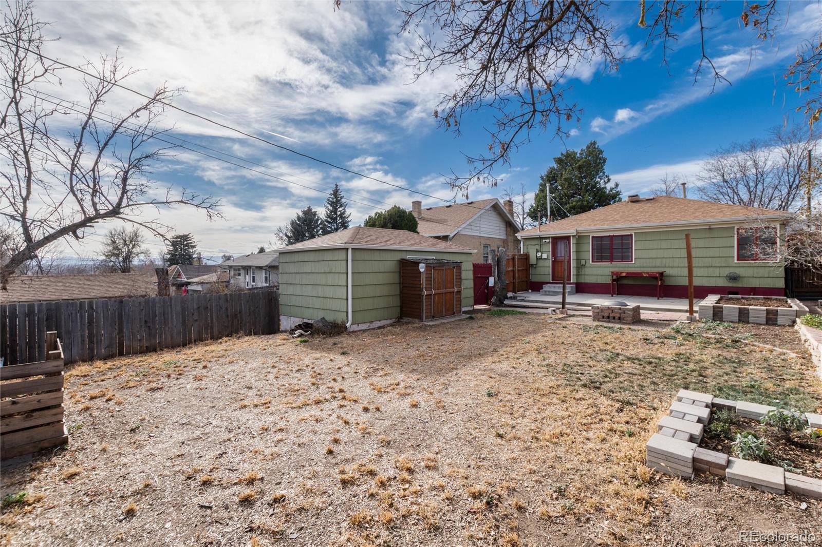 3100 Ames Street Wheat Ridge, CO 80214 - Photo 32 of 39 a view of a house with a yard and sitting area