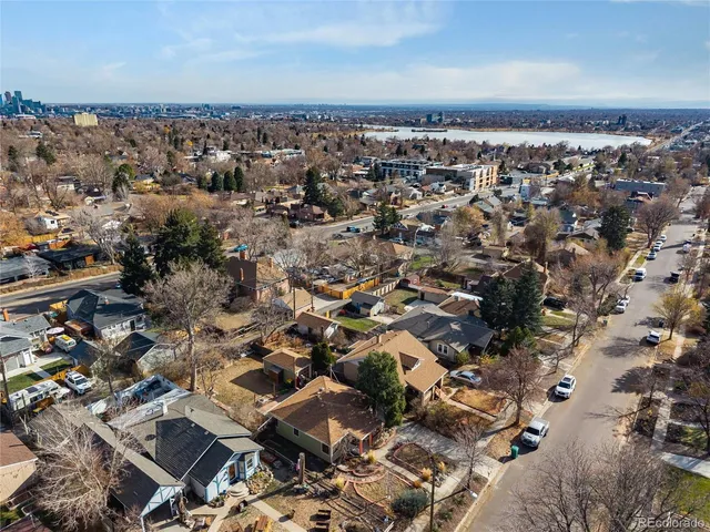 an aerial view of multiple house with yard